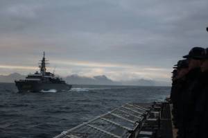 The Coast Guard Cutter Kimballs crew lines the rails in anticipation of rendering honors to the Japanese Ship Kashima, a naval training vessel of the Japan Maritime Self-Defense Force, during an at-sea exercise near Dutch Harbor on Sept. 20, 2021. (Courtesy photo / USCG)