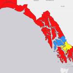 This screenshot of the Department of Health and Social Services COVID-19 cases dashboard shows the alert level in communities in Southeast Alaska. Red areas are at a high alert level and based on more than 100 cases per 100,000 people over a seven-day period. Yellow areas are at a moderate risk level based on 10-50 cases per 100,000 people over a week. Blue areas are at a low level based on 10 or fewer cases per 100,000. (Screenshot)