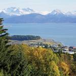 New snow dusts the higher elevations of the Kenai Mountains while birch leaves have begun to turn yellow, as seen on Monday, Sept. 27, from Reber Road in Homer. (Photo by Michael Armstrong/Homer News)