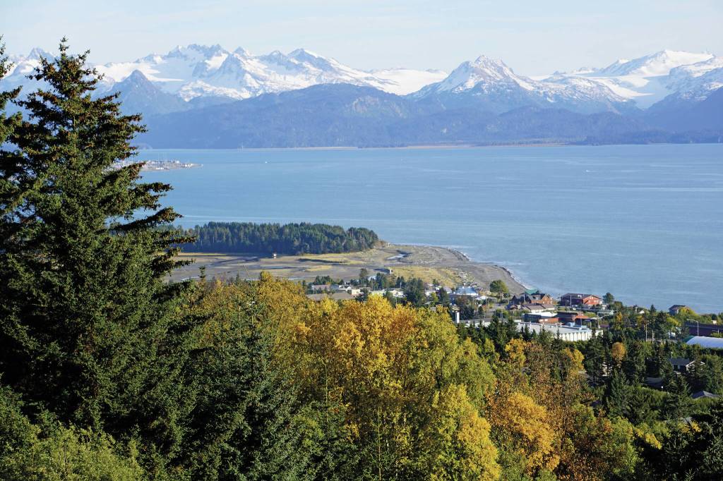 New snow dusts the higher elevations of the Kenai Mountains while birch leaves have begun to turn yellow, as seen on Monday, Sept. 27, from Reber Road in Homer. (Photo by Michael Armstrong/Homer News)