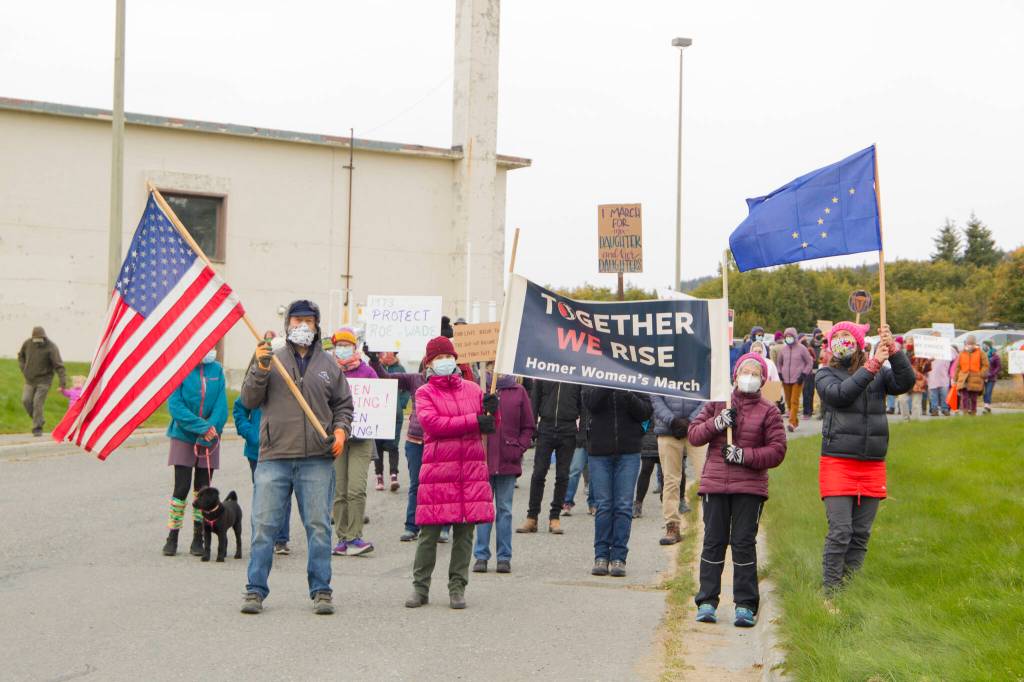 Homer community members join together to march from the HERC Campus to WKFL Park in support of womens reproductive rights. More than 100 people joined in on the march. (Photo by Sarah Knapp/Homer News)