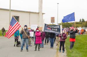 Homer community members join together to march from the HERC Campus to WKFL Park in support of womens reproductive rights. More than 100 people joined in on the march. (Photo by Sarah Knapp/Homer News)