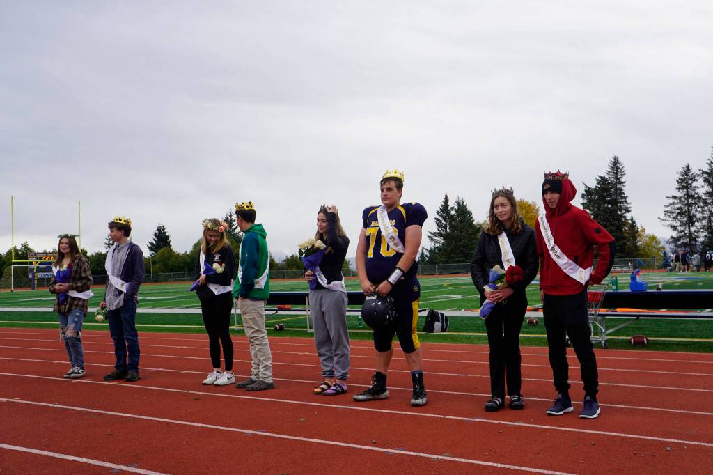 Homecoming royalty pose after being crowned at the Homer vs. Nikiski junior varsity football game on Saturday, Oct. 2, 2021, at Homer High School. From left to right are freshman class Lady Caitlyn Rogers and Lord Caleb Brow; sophomore class Duchess Minadora Reutov and Duke Camden Wise; junior class Prince Charles Van Mete and Princess Brooke Shafer, and senior class Homecoming Queen Kaylin Anderson and King Kazden Stineff. (Photo by Michael Armstrong/Homer News)