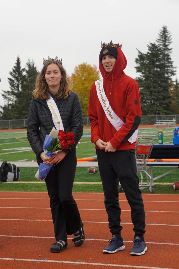 Homecoming Queen Kaylin Anderson, left, and King Kazden Stineff pose after being crowned at the Homer vs. Nikiski junior varsity football game on Saturday, Oct. 2, 2021, at Homer High School. (Photo by Michael Armstrong/Homer News)