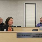 Kenai Peninsula Borough School District Assistant Superintendent Kari Dendurent (front left) and Superintendent Clayton Holland (back right) listen as Board of Education President Zen Kelly (back left) speaks at a board meeting on Monday in Soldotna. (Ashlyn OHara/Peninsula Clarion)