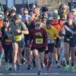 Photo by Jeff Helminiak/Peninsula Clarion
Author Kat Sorensen (252) and the rest of the field take off from the starting line at the Kenai River Marathon on Sunday, Sept. 26 in Kenai.