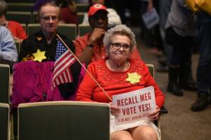 Christine Hill sits in the Municipality of Anchorage Assembly's chambers on Wednesday, Sept. 29, 2021, wearing a yellow Star of David reading "do not consent" to protest the implementation of masking requirements in public places meant to curb the spread of COVID-19. (Courtesy photo / Paxson Woelber, The Alaska Landmine)