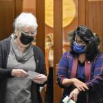 Speaker of the Alaska House of Representatives Louise Stutes, R-Kodiak, and House Minority Leader Cathy Tilton, R-Wasilla, step outside the House chambers on Monday, Oct. 4, 2021, to discuss a message from the Senate. Lawmakers entered their fourth special session Monday, with a resolution to hold committee meetings remotely. (Peter Segall / Juneau Empire)