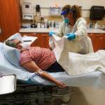 AP Photo/Rick Bowmer
Angie Cleary, a registered nurse, cares for Joyce Johnson-Albert as she receives an antibody infusion while lying on a bed in a trauma room at the Upper Tanana Health Center Wednesday, Sept. 22, 2021, in Tok, Alaska. Johnson-Albert was optimistic but also realistic. I just hope the next few days Ill be getting a little better than now, Johnson-Albert told a reporter on the other side of a closed, sliding glass door to the treatment room two days after testing positive for COVID-19 and while receiving an antibody infusion. Its just hard to say. You can go either way.
Angie Cleary, a registered nurse, cares for Joyce Johnson-Albert as she receives an antibody infusion while lying on a bed in a trauma room at the Upper Tanana Health Center Wednesday, Sept. 22, 2021, in Tok, Alaska. Johnson-Albert was optimistic but also realistic. I just hope the next few days Ill be getting a little better than now, Johnson-Albert told a reporter on the other side of a closed, sliding glass door to the treatment room two days after testing positive for COVID-19 and while receiving an antibody infusion. Its just hard to say. You can go either way. (AP Photo/Rick Bowmer)