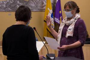 Donna Aderhold recites the Homer City Council oath of office and is sworn in for duty at the city council meeting on Oct. 11. (Photo by Sarah Knapp/Homer News)