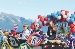 Olympic gold medalist Lydia Jacoby waves to the crowd in Seward during her celebratory parade on Thursday, August 5, 2021. (Ashlyn OHara/Peninsula Clarion)