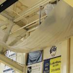 A large tarp hangs in the Homer High School gymnasium to catch water leaking through the roof at the school in Homer, Alaska. (Photo courtesy Doug Waclawski)