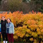The "grands" — Luca, Cecilia and Flora — pause on a fall garden walk. (Photo by Rosemary Fitzpatrick)