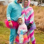Jake, Krista and Isley Parrett take on trick-or-treating on Bayview Avenue as a family of unicorns. (Photo by Sarah Knapp/Homer News)