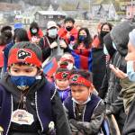 Students from Angoon donned their regalia on Tuesday, Oct. 26, 2021, for the 139th anniversary of the bombardment of Angoon by the U.S. Navy. Despite the violence, Angoon residents say the fact the village remains is a testament to their endurance. (Peter Segall / Juneau Empire)