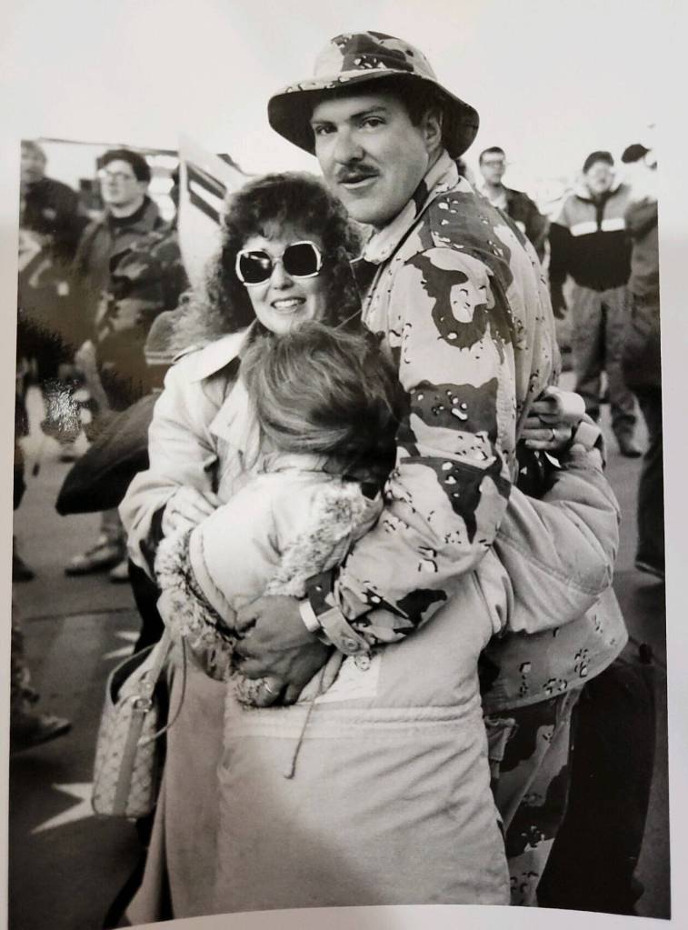 Leroy Keene returns home from Desert Storm in 1990 and is welcomed by his wife and daughter. (Photo provided by Leroy Keene)