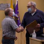 Mayor Ken Castner thanks former council member Heath Smith for his six years of service to the community. (Photo by Sarah Knapp/Homer News)