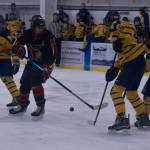 A crew of Mariners block a Kardinal player from advancing to the goal during the game Friday, Nov. 5 at Kevin Bell Arena. (Photo by Sarah Knapp/Homer News)