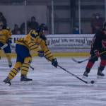 Mariners Sam Banks moves the puck down the rink against the Kardinals on Friday, Nov. 5 at the Kevin Bell Arena. (Photo by Sarah Knapp/Homer News)
