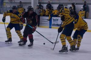 A crew of Mariners block a Kardinal player from advancing to the goal during the game Friday, Nov. 5 at Kevin Bell Arena. (Photo by Sarah Knapp/Homer News)