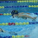 Homers Carly Nelson competes in the state swimming finals at Bartlett High School in Anchorage on Saturday, Nov. 6, 2021. (Camille Botello/Peninsula Clarion)