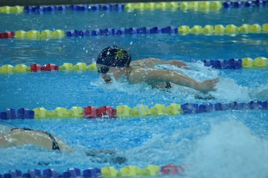Homers Carly Nelson competes in the state swimming finals at Bartlett High School in Anchorage on Saturday, Nov. 6, 2021. (Camille Botello/Peninsula Clarion)