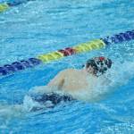 Kenais Koda Poulin competes in the state swimming finals at Bartlett High School in Anchorage on Saturday, Nov. 6, 2021. (Camille Botello/Peninsula Clarion)