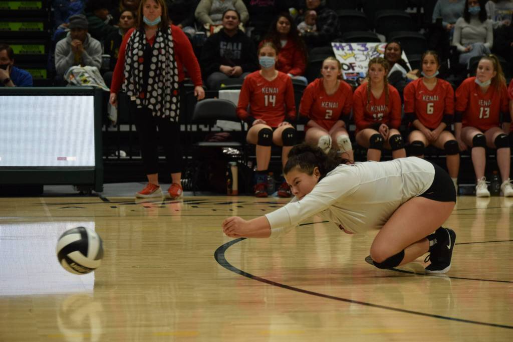 Kenai libero Valerie Villegas dives for a ball during the 3A state volleyball championship game at the Alaska Airlines Center in Anchorage on Saturday, Nov. 13, 2021. (Camille Botello/Peninsula Clarion)
