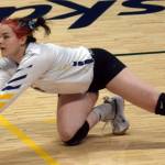 Homer libero Zoe Adkins dives for a ball during the Class 3A state volleyball consolation game at the Alaska Airlines Center in Anchorage, Alaska, on Saturday, Nov. 13, 2021. (Camille Botello/Peninsula Clarion)