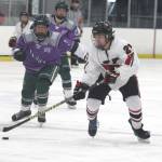 Kenai Centrals Ayden Spann skates the puck across the blue line during a 4-1 loss to Colony during the second day of the 2021 Alaska Army National Guard Stars and Stripes Showdown on Friday, Nov.12, 2021, at the MTA Events Center in Palmer, Alaska. (Photo by Jeremiah Bartz/Frontiersman)