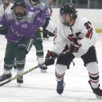 Kenai Central’s Ayden Spann skates the puck across the blue line during a 4-1 loss to Colony during the second day of the 2021 Alaska Army National Guard Stars and Stripes Showdown on Friday, Nov.12, 2021, at the MTA Events Center in Palmer, Alaska. (Photo by Jeremiah Bartz/Frontiersman)