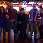 Quilts of Valor recipients Gary Squires (left) and Leroy Keene (right) are pictured after being covered in their quilts along with their family. (Photo by Sarah Knapp/Homer News)