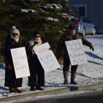 Demonstrators gather outside of Central Peninsula Hospital in Soldotna to protest COVID-19 vaccine mandates and advocate for alternative treatments on Saturday, Nov. 20, 2021. (Camille Botello/Peninsula Clarion)