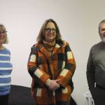 Kathy Gensel (left), Leslie Rohr (center) and Tim Navarre (right) stand in a bedroom at a cold weather shelter set to open next month on Monday, Nov. 22, 2021 in Nikiski, Alaska. (Ashlyn O'Hara/Peninsula Clarion)