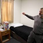 Tim Navarre, president of the Kenai Peninsula Foundation, stands in a bedroom at a cold weather shelter set to open next month on Monday, Nov. 22, 2021 in Nikiski, Alaska. (Ashlyn OHara/Peninsula Clarion)