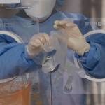 A medical worker wears plastic gloves at a temporary screening clinic for the coronavirus in Seoul, South Korea, Monday, Nov. 29, 2021. The emergence of the new omicron variant and the world’s desperate and likely futile attempts to keep it at bay are reminders of what scientists have warned for months: The coronavirus will thrive as long as vast parts of the world lack vaccines. (AP Photo/Lee Jin-man)