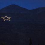 The Joint Base Elmendorf-Richardson star is Illuminated on the side of Mount Gordon Lyon on Wednesday, Sept. 11, 2019, just east of Anchorage, Alaska, in observation of the 18th anniversary of the terrorist attacks. A crew from the base went to light the 300-foot wide holiday star, but found that only half of the stars 350 or so lights were working, the Anchorage Daily News reported. Airmen from the 773rd Civil Engineer Squadron Electrical Shop havent been able to figure out what was wrong and repair the lights, but they plan to work through the week, if necessary, base spokesperson Erin Eaton said. (Bill Roth/Anchorage Daily News via AP)