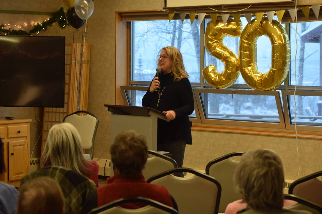 Kathy Romain, the executive director of the Kenai Senior Center, hosts a reception to celebrate the facility's 50 years on Tuesday, Nov. 30, 2021. (Camille Botello/Peninsula Clarion)
