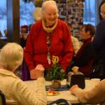 Community members gather for the Kenai Senior Center's 50th anniversary reception on Tuesday, Nov. 30, 2021. (Camille Botello/Peninsula Clarion)