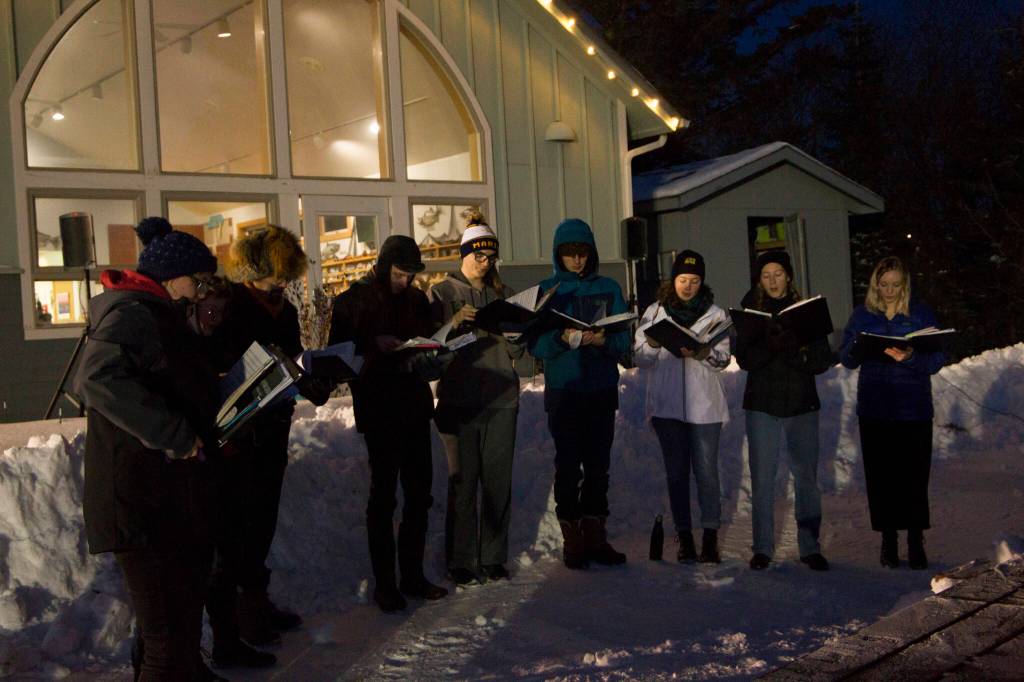 The Homer High School choir entertained the crowd at the Homer Chamber of Commerce holiday tree lighting ceremony with Christmas carols. (Photo by Sarah Knapp/Homer News)