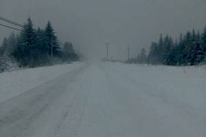 Diamond Ridge Road near Homer, Alaska, had been plowed on Monday morning, Dec. 5, 2021, but visibility was limited. (Photo by Michael Armstrong/Homer News)