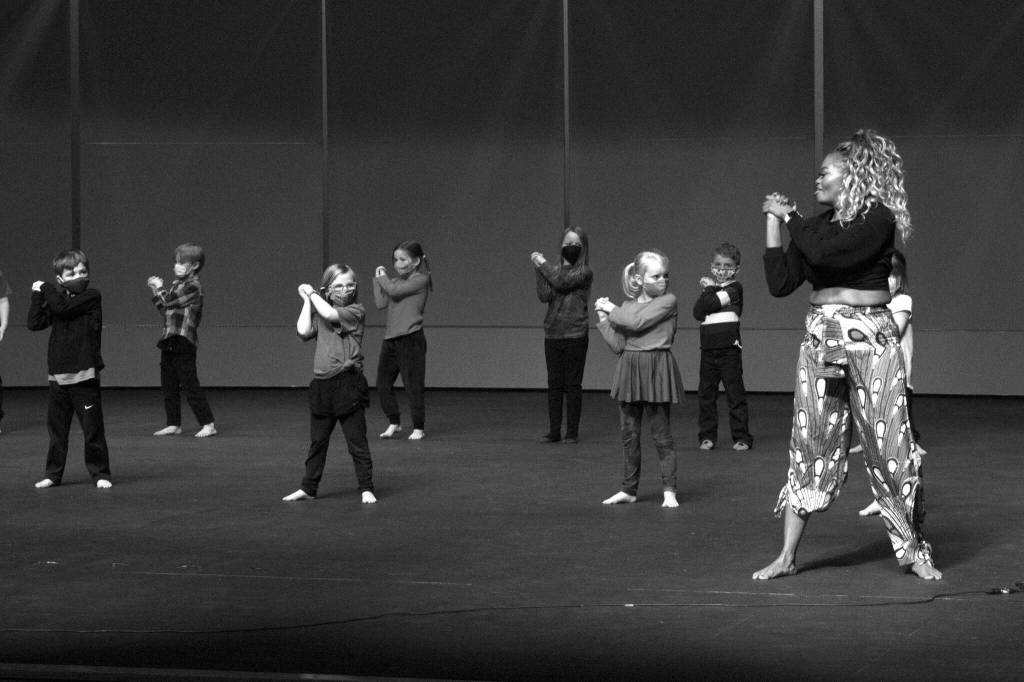 Kasha Smith-Poynter leads the first graders in their dance on Friday, Dec. 3 at Homer High School. (Photo by Sarah Knapp/Homer News)