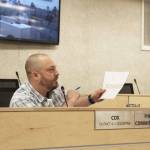 Tyson Cox references a sheet illustrating the rotation of seats on the Kenai Peninsula Borough Planning Commission during a meeting of the Kenai Peninsula Borough Assembly on Tuesday, Dec. 7, 2021 in Soldotna, Alaska. (Ashlyn OHara/Peninsula Clarion)