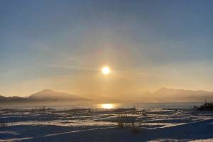At mid-day on Tuesday, Dec. 21, 2021, as seen at Bishops Beach the sun is as low to the horizon as it will be all year in Homer, Alaska. After the Winter Solstice, the sun will rise higher and higher at solar noon each day, with daylight hours also increasing. (Photo by Michael Armstrong/Homer News)