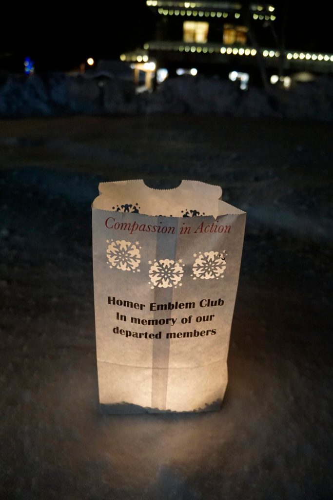 A luminaria honoring departed Homer Emblem Club members is one of the memorials placed on Thursday, Dec. 16, 2021, for Hospice of Homers LIght Up a Life event at WKFL Park in Homer, Alaska. (Photo by Michael Armstrong/Homer News)