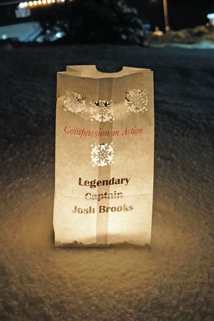 A luminaria honoring Josh Brooks is one of the memorials placed on Thursday, Dec. 16, 2021, for Hospice of Homers LIght Up a Life event at WKFL Park in Homer, Alaska. (Photo by Michael Armstrong/Homer News)