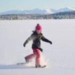 Drew Slegers, a fourth grader at Soldotna Elementary, snowshoes on Headquarters Lake just outside of Soldotna, Alaska, on Tuesday, Dec. 21, 2021. (Photo by Jeff Helminiak/Peninsula Clarion)