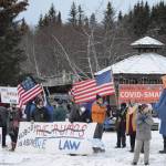 About 50 people protest the Jan. 6, 2021, riot at the U.S. Capitol on Saturday, Jan. 9, 2021, at WKFL Park in Homer, Alaska. The group reacted to the events in which rioters broke into the U.S. Capitol while Congress attempted to tally the Electoral College results in which former Vice President Joe Biden won the presidential election.Charles Aguilar, far right, wore a Trump puppet costume. (Photo by Michael Armstrong/Homer News)
