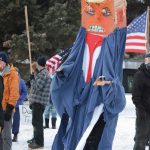 Charles Aguilar wears a President Donald Trump puppet at a protest against Trump on Saturday, Jan. 9, 2021, at WKFL Park in Homer, Alaska. He was part of about 50 people who reacted to the events of Jan. 6, 2021, in which rioters broke into the U.S. Capitol while Congress attempted to tally the Electoral College results in which former Vice President Joe Biden won the presidential election. (Photo by Michael Armstrong/Homer News)