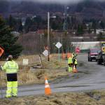 Flaggers control traffic on Friday, April 23, 2021, during preliminary construction work on Lake Street in Homer, Alaska. Rehabilitation work will be done on the street this spring and summer. (Photo by Michael Armstrong/Homer News)